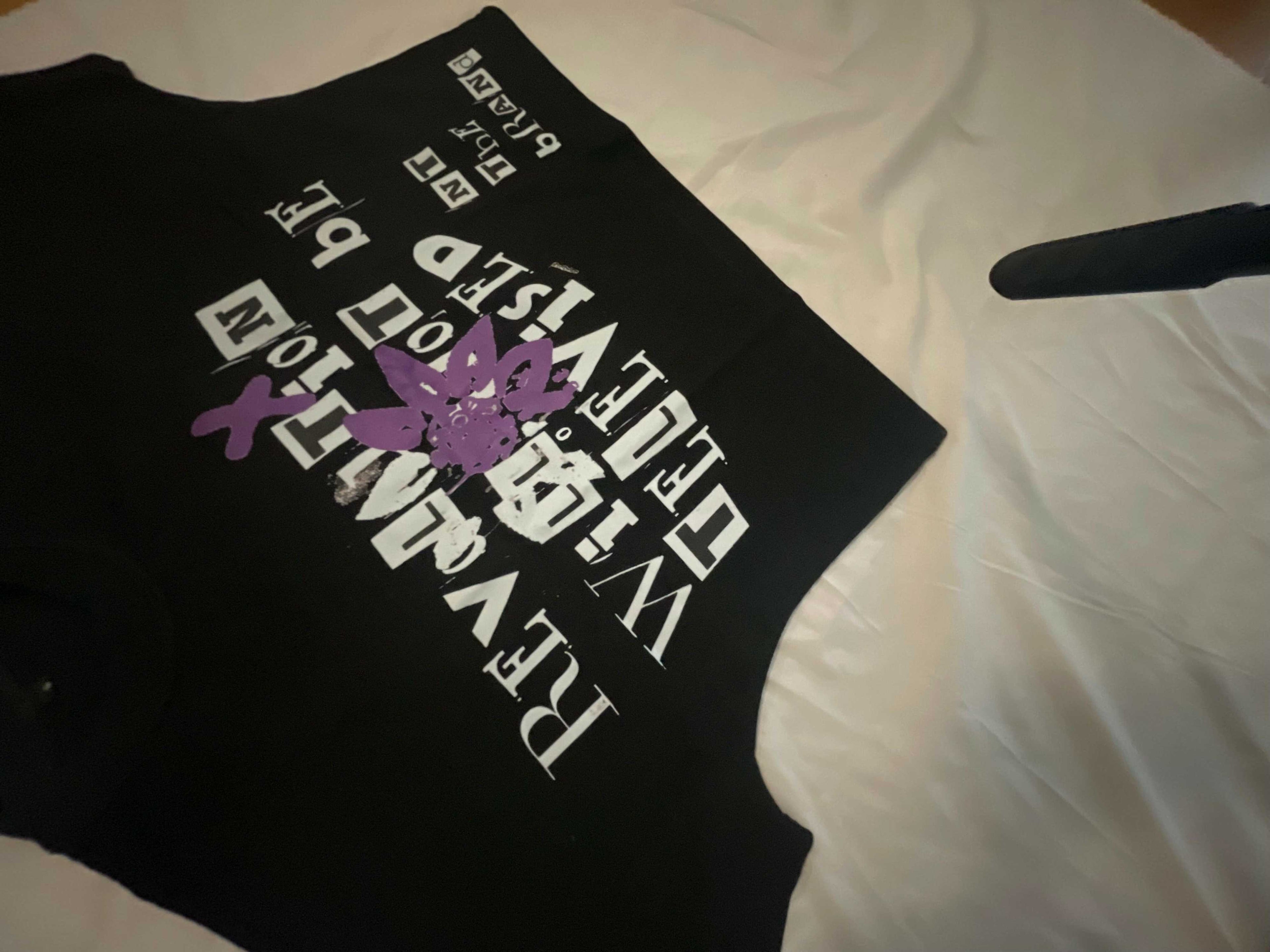 Black RWNBT Box  T-shirt with purple flower and white printed text design on front in box fit style.