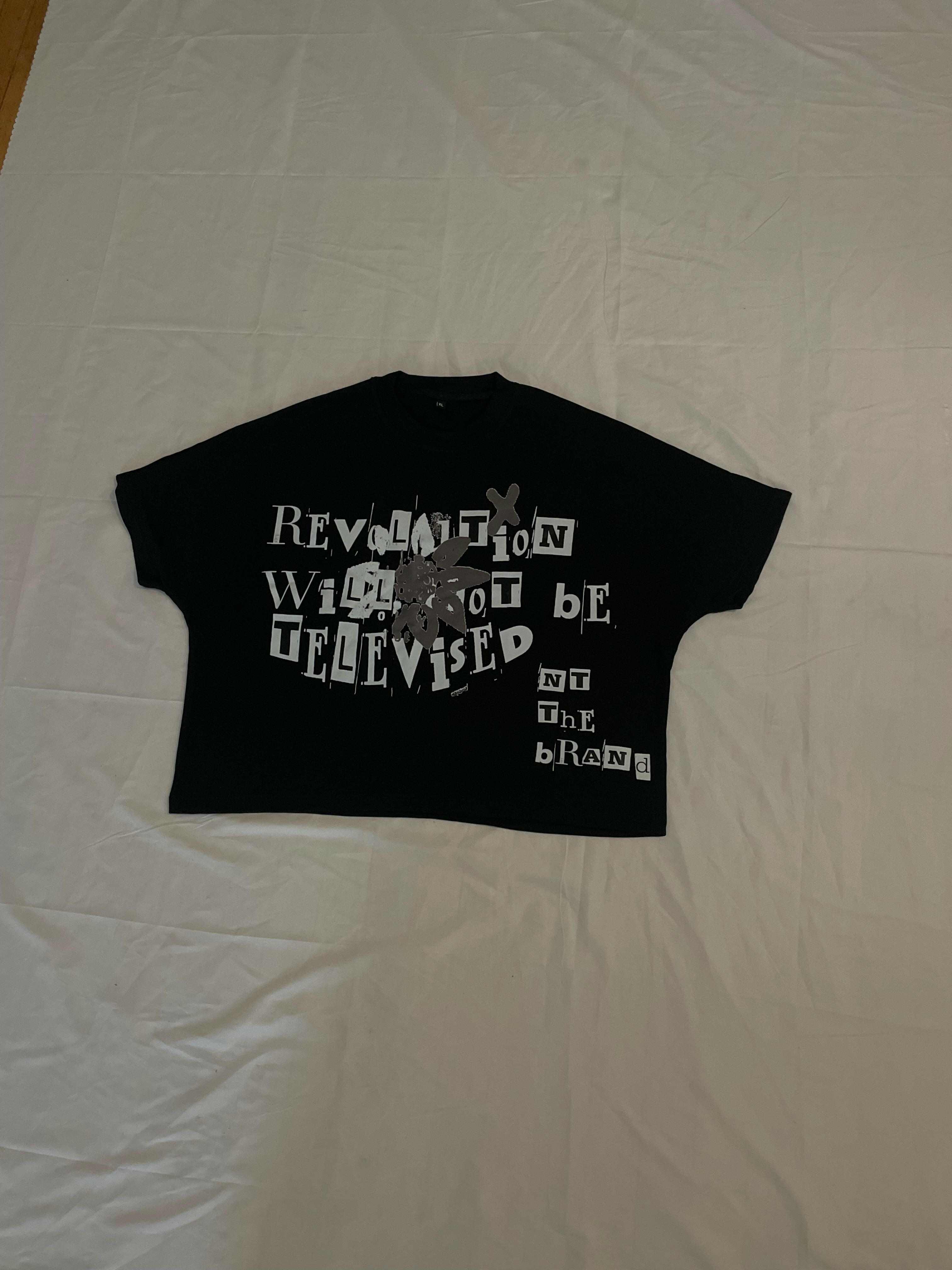 Black RWNBT shirt with silver screen printed crewneck box fit design and revolutionary text logo
