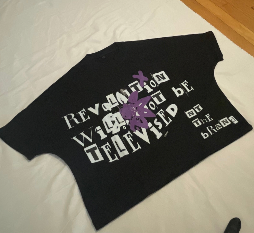 Black RWNBT Box T-shirt with front purple flower X symbol and white mixed font text design