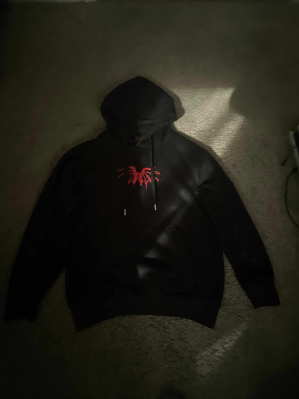 Black X6 Creature hoodie with red design, men's cotton drawstring sweatshirt with double side pockets and heat printed triple X on sleeves